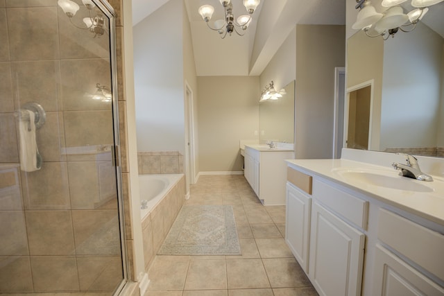 bathroom with tile patterned floors, a notable chandelier, lofted ceiling, and vanity