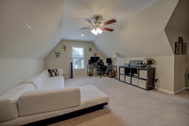 carpeted living room with ceiling fan and lofted ceiling