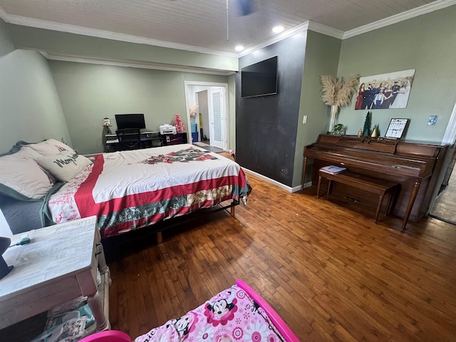 bedroom featuring hardwood / wood-style flooring, ceiling fan, and crown molding