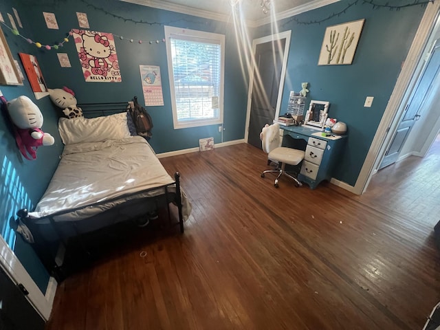 bedroom featuring hardwood / wood-style flooring and crown molding