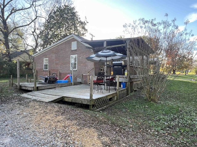 back of property with a deck