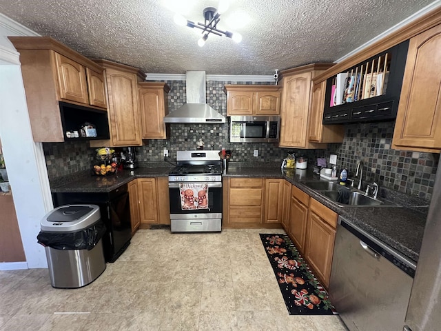 kitchen with sink, wall chimney exhaust hood, a notable chandelier, backsplash, and appliances with stainless steel finishes