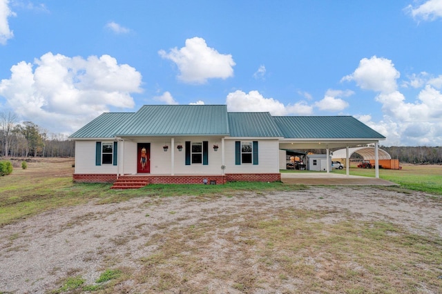 view of front of property with a carport and covered porch