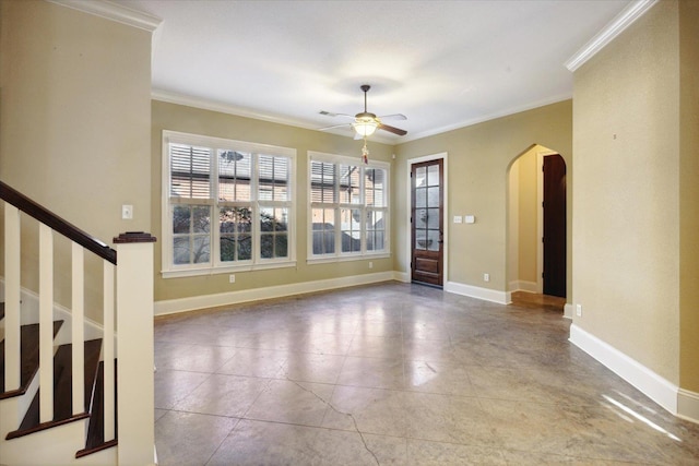 258 S Mclean Blvd, Memphis, TN 38104 - unfurnished room with arched walkways, crown molding, a ceiling fan, stairs, and baseboards