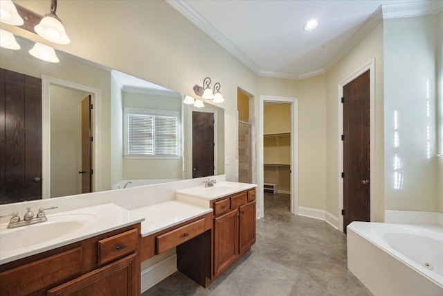 bathroom with a bathing tub, vanity, and crown molding