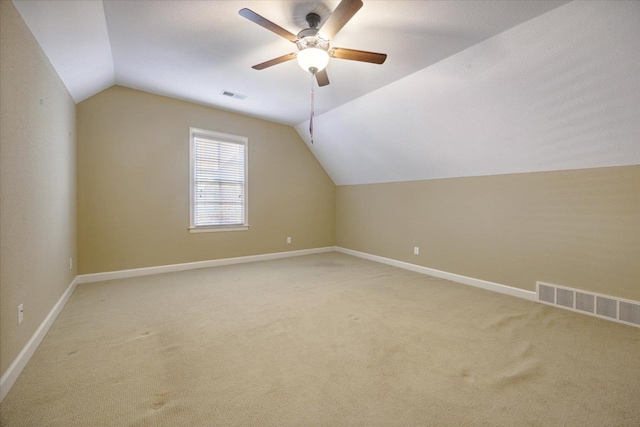 additional living space with ceiling fan, lofted ceiling, and carpet floors