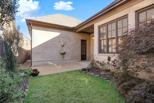 exterior space with a lawn and a patio area