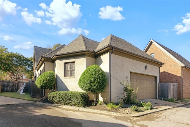 view of side of home with a garage