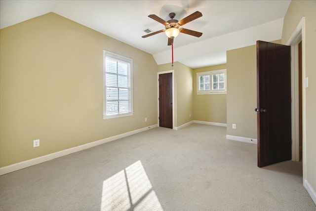 258 S Mclean Blvd, Memphis, TN 38104 - unfurnished bedroom with light carpet, vaulted ceiling, baseboards, and ceiling fan