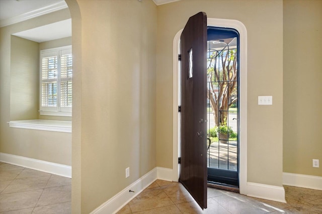 tiled entryway with crown molding