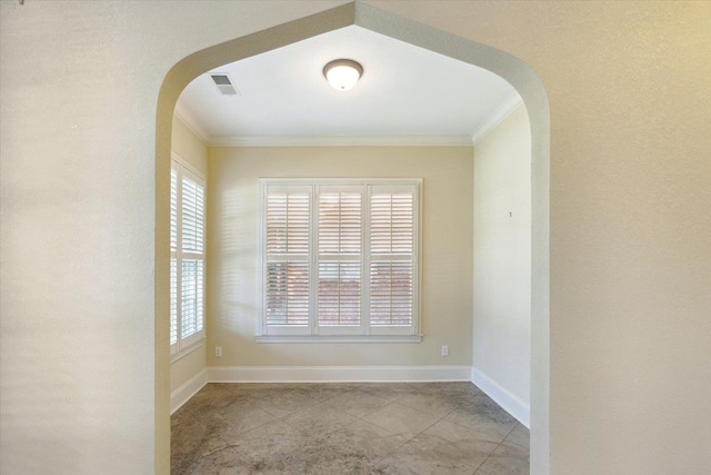 unfurnished room featuring ornamental molding