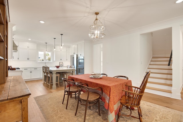 dining space with light hardwood / wood-style floors