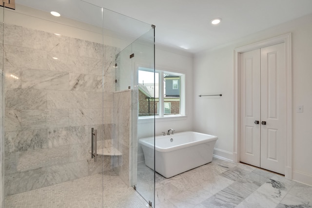 bathroom with shower with separate bathtub