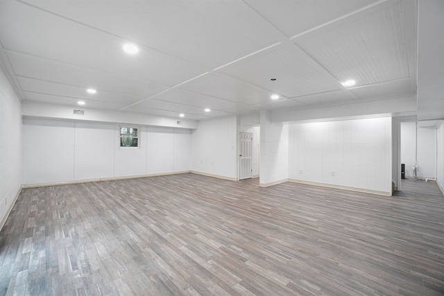 basement with hardwood / wood-style flooring