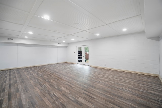 spare room with dark wood-type flooring and coffered ceiling