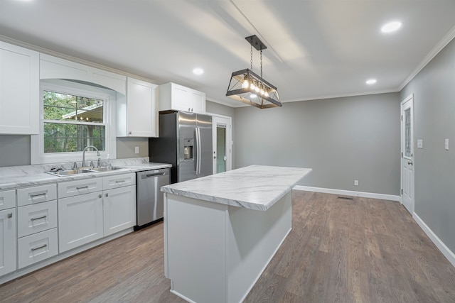 kitchen featuring white cabinetry, sink, and appliances with stainless steel finishes