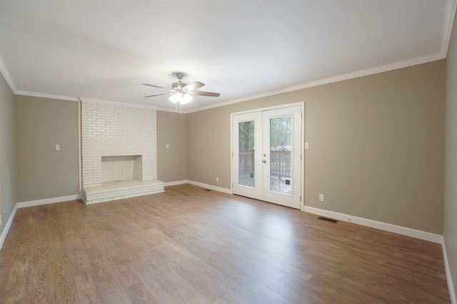 unfurnished living room with hardwood / wood-style floors, ceiling fan, crown molding, and french doors