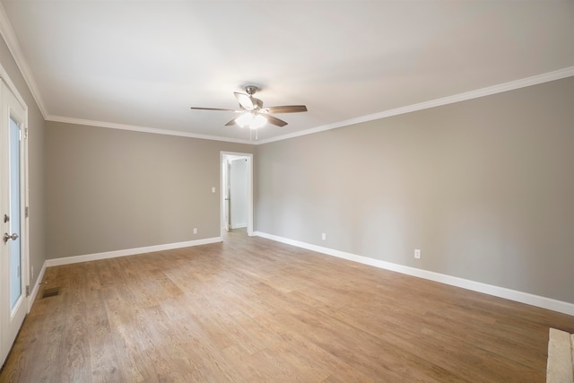 unfurnished room with hardwood / wood-style floors, ceiling fan, and crown molding