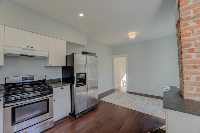 kitchen featuring white cabinets, stainless steel appliances, and dark wood-type flooring