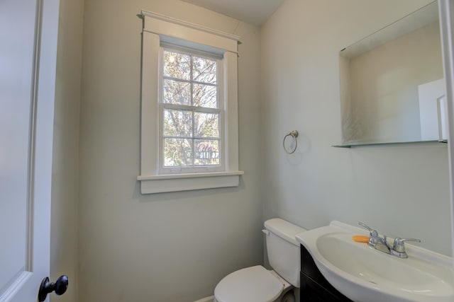 bathroom with vanity and toilet