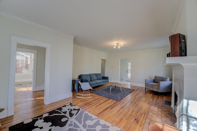 living room with wood-type flooring and crown molding