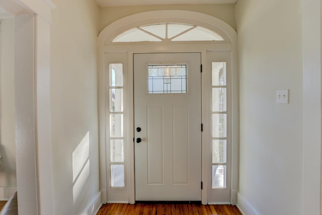 foyer entrance featuring dark hardwood / wood-style floors