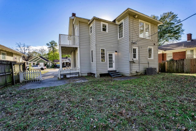 back of property with central AC