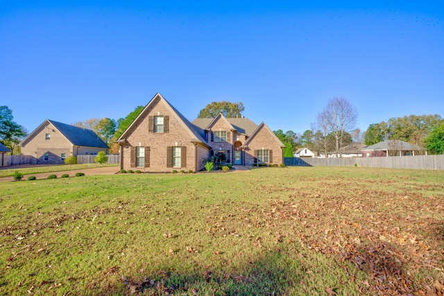 back of house featuring a lawn