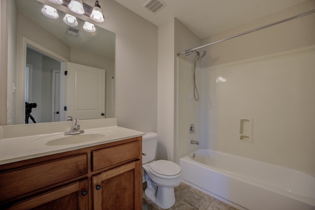 full bathroom with tile patterned floors, vanity, toilet, and washtub / shower combination