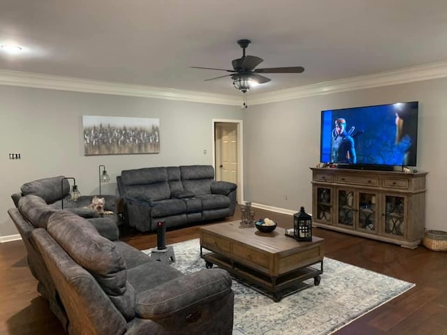 living room featuring ceiling fan, crown molding, and dark wood-type flooring