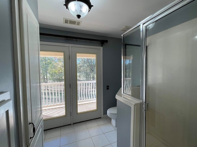 entryway with light tile patterned floors