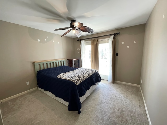 carpeted bedroom featuring access to exterior and ceiling fan