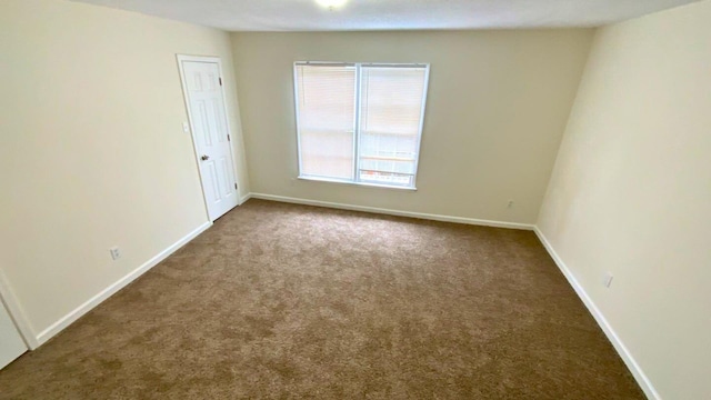 unfurnished room with carpet flooring