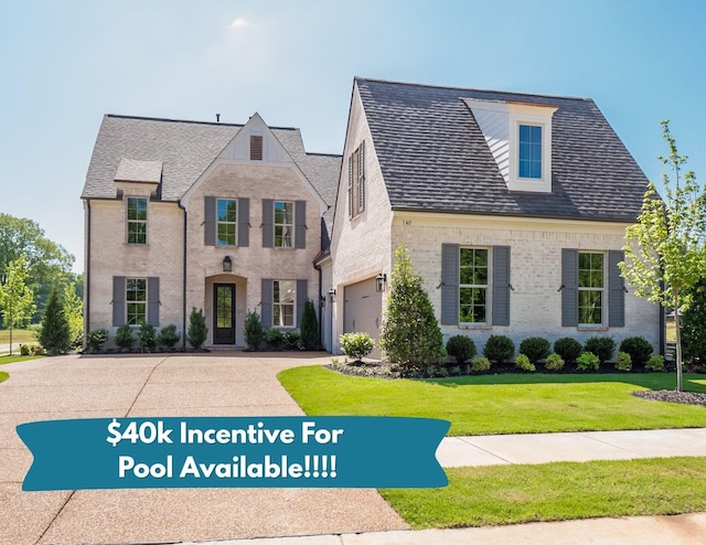 140 Magnolia Ridge Dr, Rossville, TN 38066 - french country inspired facade with a front lawn, driveway, brick siding, and an attached garage