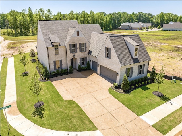 140 Magnolia Ridge Dr, Rossville, TN 38066 - view of front of home with roof with shingles, driveway, an attached garage, and a front yard