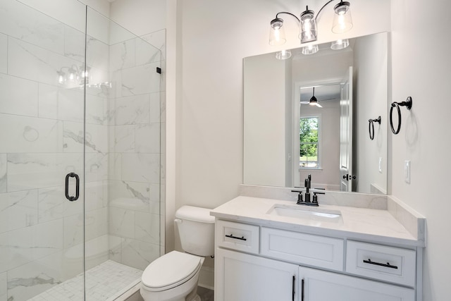 140 Magnolia Ridge Dr, Rossville, TN 38066 - bathroom featuring a stall shower, toilet, vanity, and a ceiling fan