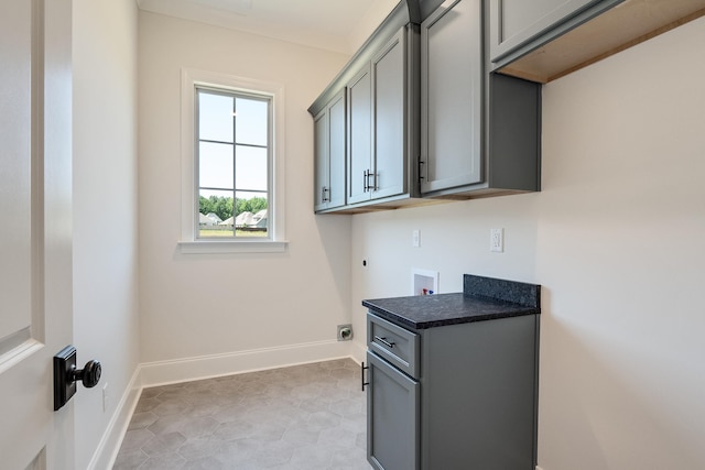 laundry room featuring hookup for an electric dryer, gas dryer hookup, cabinets, and hookup for a washing machine