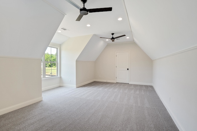 bonus room with ceiling fan, lofted ceiling, and light carpet