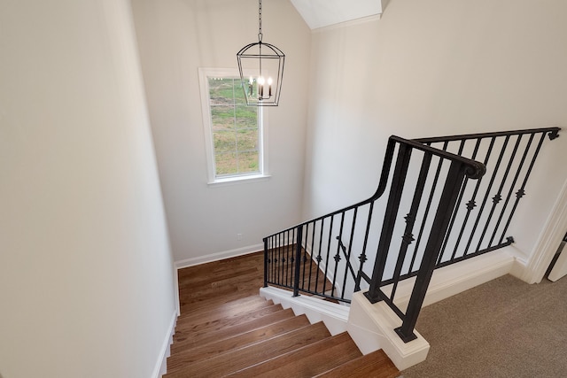 140 Magnolia Ridge Dr, Rossville, TN 38066 - stairway with a chandelier, baseboards, vaulted ceiling, and wood finished floors