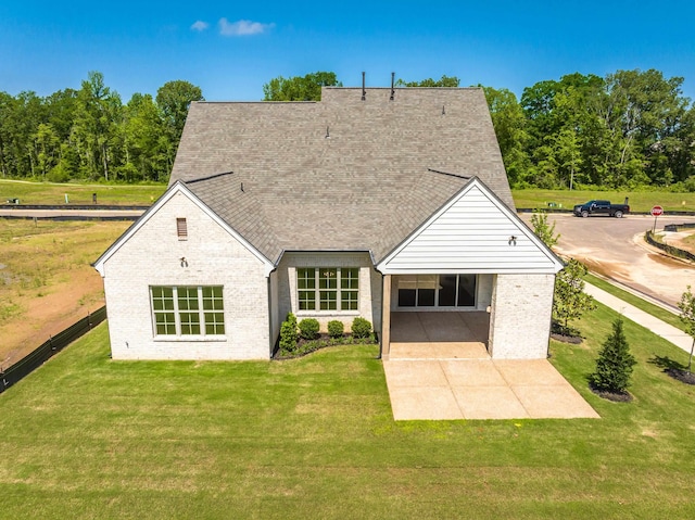 140 Magnolia Ridge Dr, Rossville, TN 38066 - back of property featuring a patio area, brick siding, and a lawn