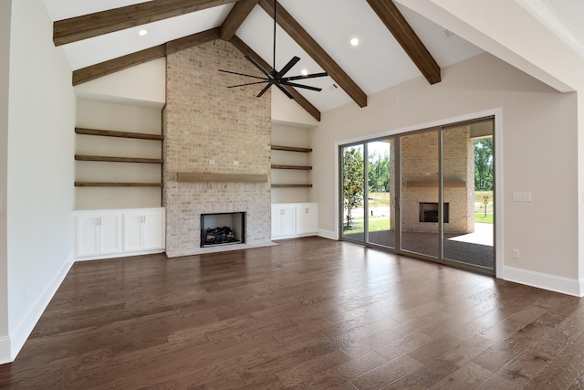 unfurnished living room with a fireplace, high vaulted ceiling, and dark hardwood / wood-style floors