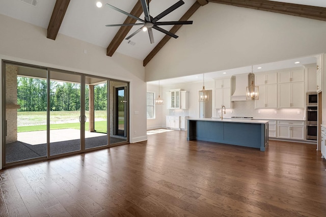 140 Magnolia Ridge Dr, Rossville, TN 38066 - unfurnished living room with a ceiling fan, beamed ceiling, high vaulted ceiling, a chandelier, and dark wood-type flooring