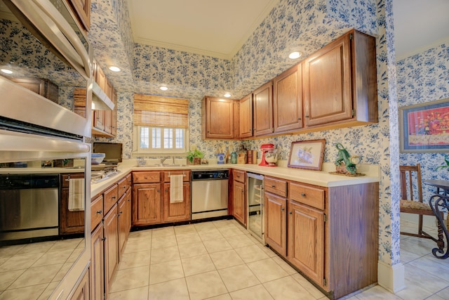 kitchen with light tile patterned floors, stainless steel appliances, crown molding, and sink