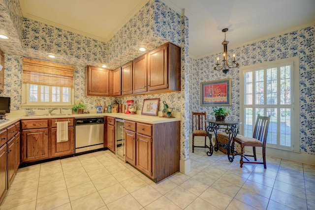 kitchen featuring stainless steel dishwasher, pendant lighting, crown molding, and a wealth of natural light