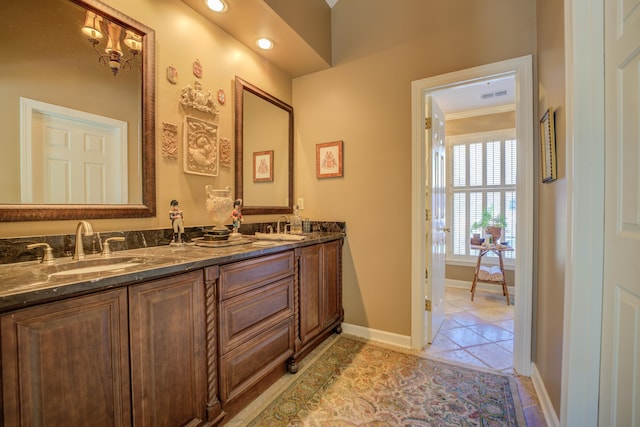 bathroom with tile patterned flooring, vanity, and ornamental molding