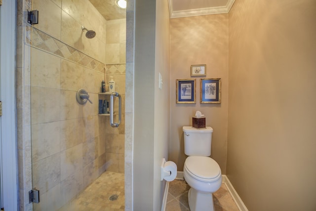 bathroom with tile patterned flooring, toilet, an enclosed shower, and ornamental molding