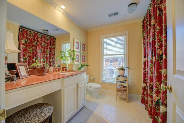 bathroom featuring vanity, toilet, and crown molding