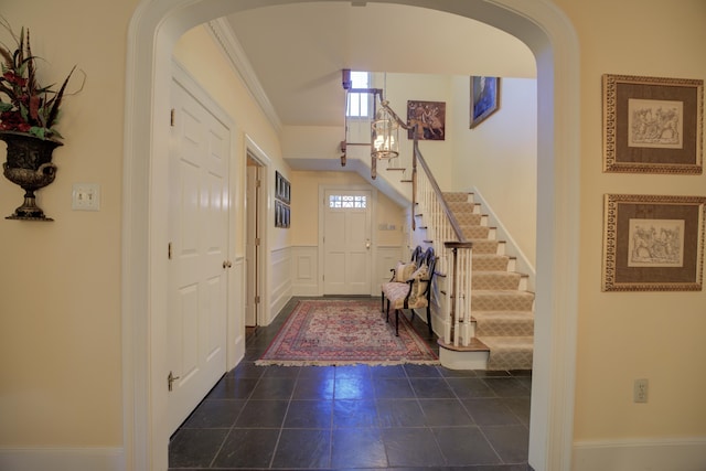 entryway with crown molding