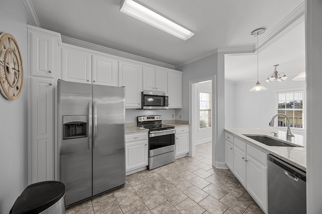 6 Laura Ln, Iuka, MS 38852 - kitchen with stainless steel appliances, sink, pendant lighting, a chandelier, and white cabinetry