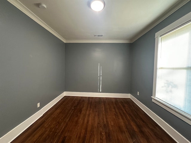 unfurnished room with dark hardwood / wood-style floors, crown molding, and a healthy amount of sunlight